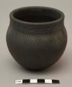 Small pot with incised design at shoulder and neck; signed TTarbell '85