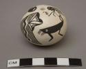 Miniature white seed pot with black Mimbres-style designs; signed Acoma, NM / B. J. Cerno 12-77