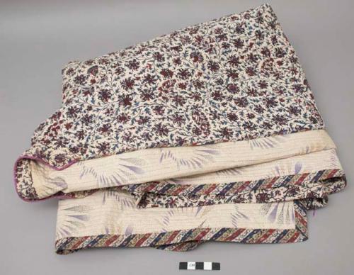 Man's gown, qaba; Qajar Dynasty, late 19th c.; floral arabesque outer fabric, lining in pastel purple and green.