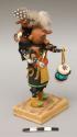 Katsina; entitled "Mudheads," adult with drum; mudhead child on back with rattle; signed "Mudhead by Norman Tom"
