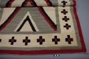 Navajo rug with central diamond design and borders; gray, black, red and white wool