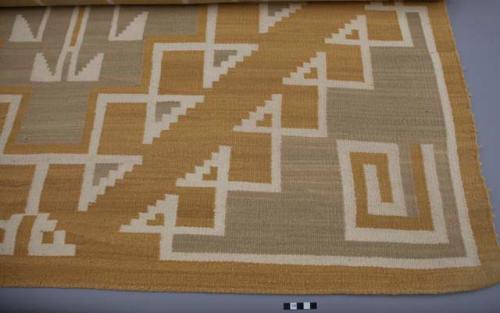 Navajo rug with geometric design; gray, rust and white wool