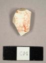 Creamware sherd with red transfer print overglaze