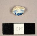 Whiteware sherd with blue on white transfer print decoration on interior