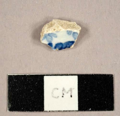 Whiteware sherd with blue on white transfer print decoration on interior