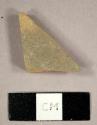 Buff stoneware sherd with grey lead glaze on exterior