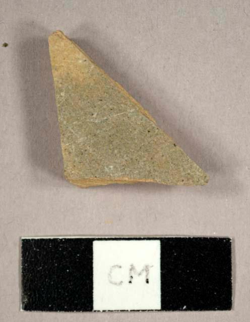 Buff stoneware sherd with grey lead glaze on exterior