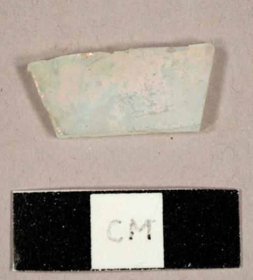 Colorless flat glass fragment, possibly frosted