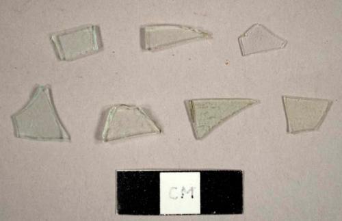 Colorless glass fragments, including some possibly from a hurricane lamp