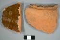 Red earthenware pot fragments with lead glaze on the interior, including one rim sherd