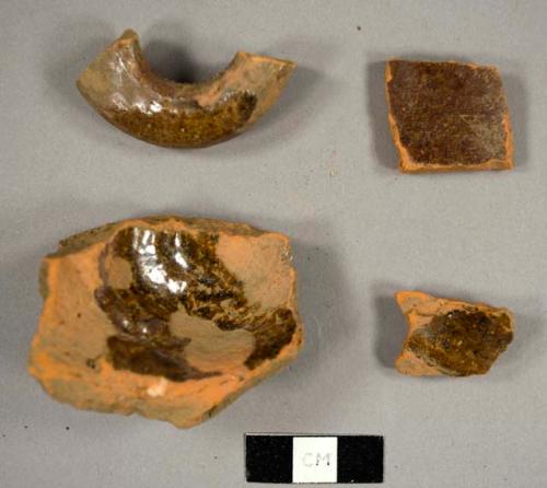 Lead glazed red earthenware fragments, including a small jug base and handle fragment