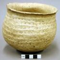 Part corrugated pottery jar