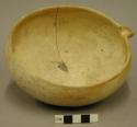 Ceramic bowl, yellow, undecorated, molded spout, cracked, base sherd missing