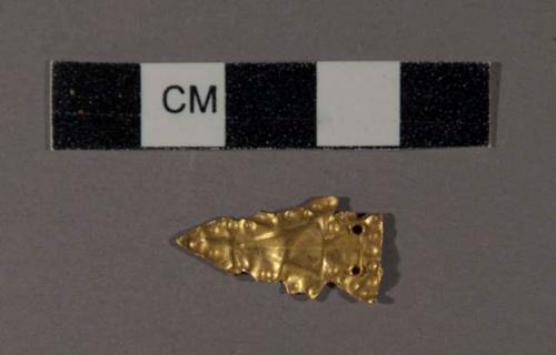 Gold ornament in shape of projectile point