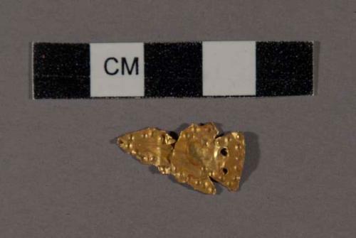 Gold ornament in shape of projectile point