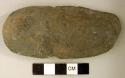 Ground stone, worked stone object, partially perforated