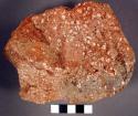 Large block of porphoritic red. lithic material. hematite?