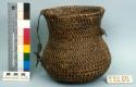 Utility basket, coiled. Made of bear grass. With leather straps.