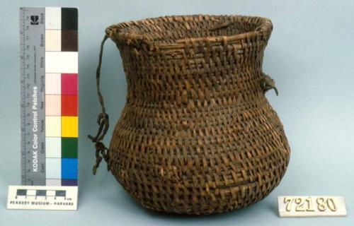 Utility basket, coiled. Made of bear grass. With leather straps.