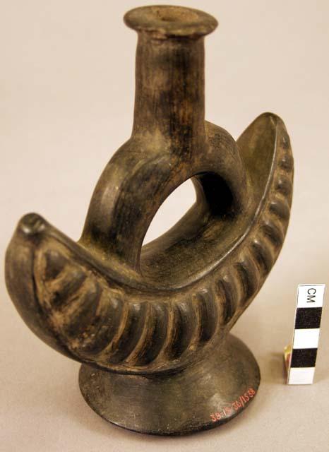 Black stirrup-spouted vessel