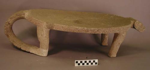 Stone metate- animal effigy