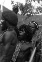 Samuel Putnam negatives, New Guinea; 3 men singing Etai very lustiliy