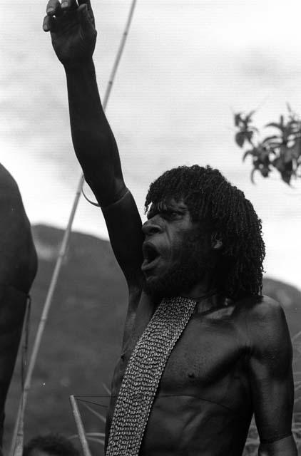 Samuel Putnam negatives, New Guinea; man singing Etai very lustiliy