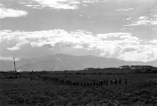 Samuel Putnam negatives, New Guinea; men going towards Hellerabet on their way to the Liberek