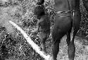 Samuel Putnam negatives, New Guinea; a little boy and a man crossing a foot bridge across a garden ditch