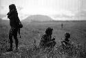 Samuel Putnam negatives, New Guinea; women sitting outside the sien forest near Homoak