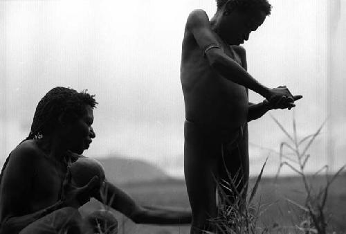 Samuel Putnam negatives, New Guinea; Kusa and a woman outside Homoak