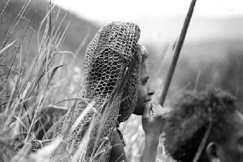 Samuel Putnam negatives, New Guinea;  woman watching Etai