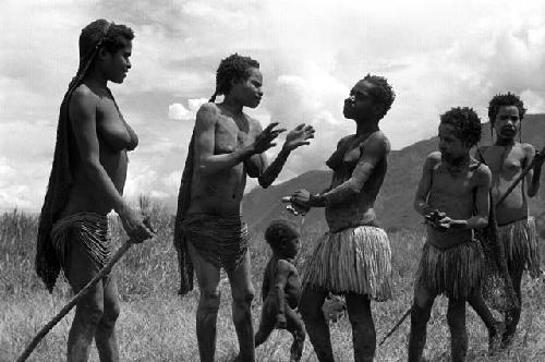 Samuel Putnam negatives, New Guinea; women and girls putting on clay