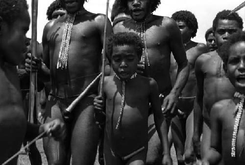 Samuel Putnam negatives, New Guinea; Tukom and warriors behind him and around him singing and dancing Etai