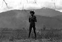 Samuel Putnam negatives, New Guinea; full length of Walimo; northeastern mt. wall behind him