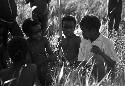 Samuel Putnam negatives, New Guinea; Etai; little boys including Uwar surround another little boy in a white shirt and blue pants