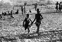 Samuel Putnam negatives, New Guinea; 2 little girls running on the Liberek