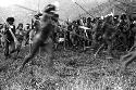 Samuel Putnam negatives, New Guinea; men dancing; going in a counter clockwise direction on the Liberek