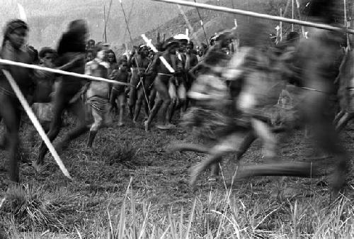 Samuel Putnam negatives, New Guinea; men dancing; going in a counter clockwise direction on the Liberek