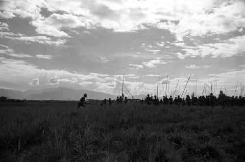 Samuel Putnam negatives, New Guinea; warriors dancing on their way to the Liberek