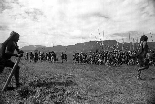 Samuel Putnam negatives, New Guinea; men and women dancing on Liberek; in the frgd 2 women go in to join