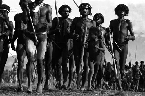 Samuel Putnam negatives, New Guinea; low angle of men running towards the camera