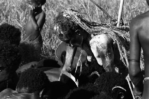 Samuel Putnam negatives, New Guinea; woman doing something in a group of children