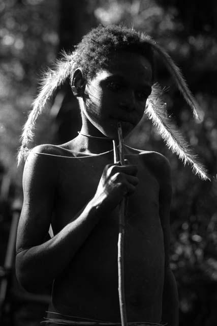 Samuel Putnam negatives, New Guinea; Okal; portrait with just feathery weeds hanging from his hair head and shoulders