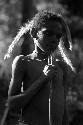 Samuel Putnam negatives, New Guinea; Okal; portrait with just feathery weeds hanging from his hair head and shoulders