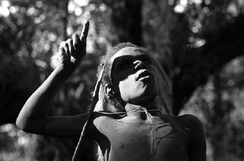 Samuel Putnam negatives, New Guinea; Okal; portrait with just feathery weeds hanging from his hair head and shoulders