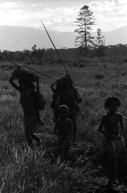 Samuel Putnam negatives, New Guinea; women and children on the path; near Abulupak