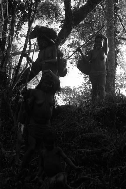 Samuel Putnam negatives, New Guinea; women walking down towards the Elokhere River