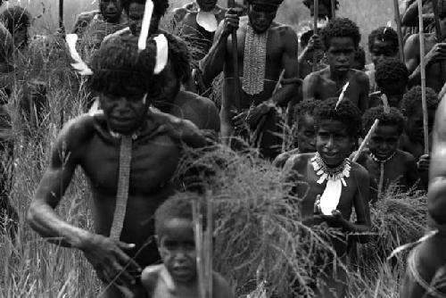 Samuel Putnam negatives, New Guinea; men running on their way to the Liberek- dancing for an Etai