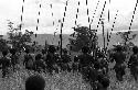 Samuel Putnam negatives, New Guinea; backs of men on their way from or to Puakoloba; day of an Etai